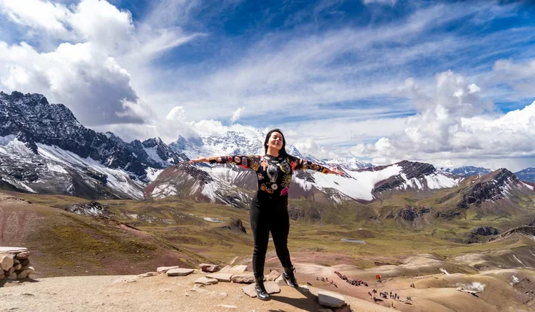 Enjoying the atmosphere at the top of Rainbow Mountain